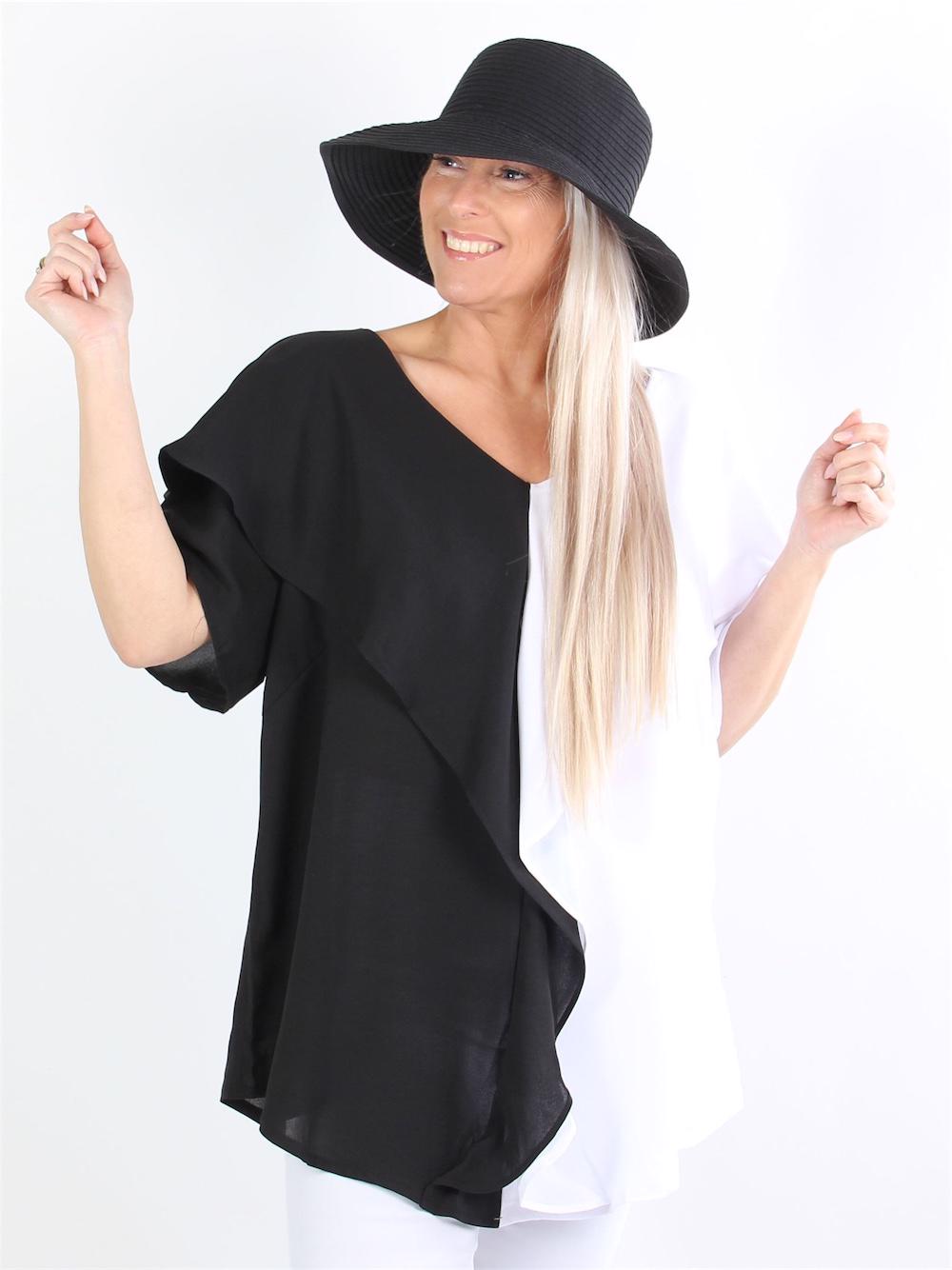 Arianna - Svart och vit blus med volanger